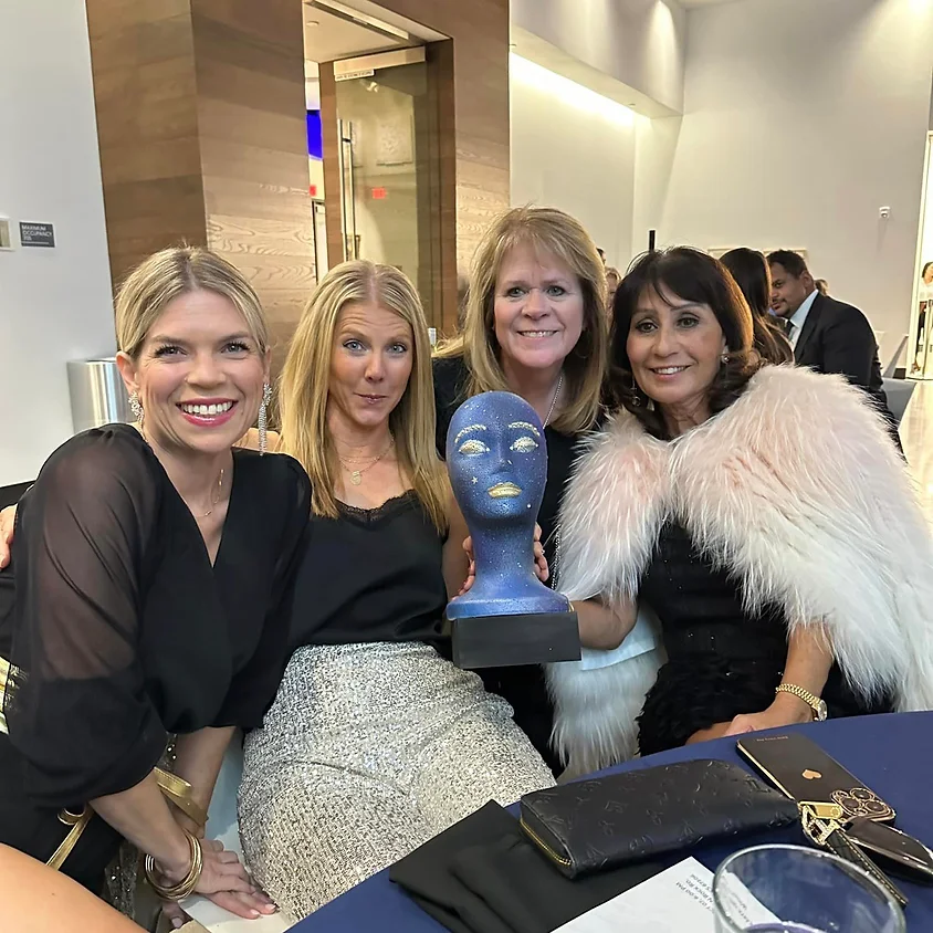Guests smiling together at the Beautiful Minds Gala