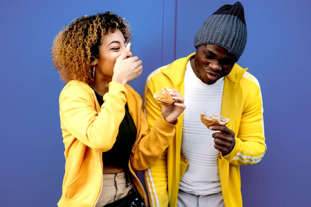 Two friends laughing together outdoors