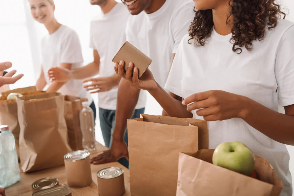 Volunteers packing donation bags together
